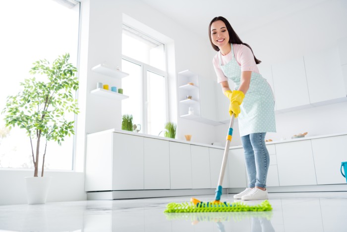 female house cleaner doing floor cleaning